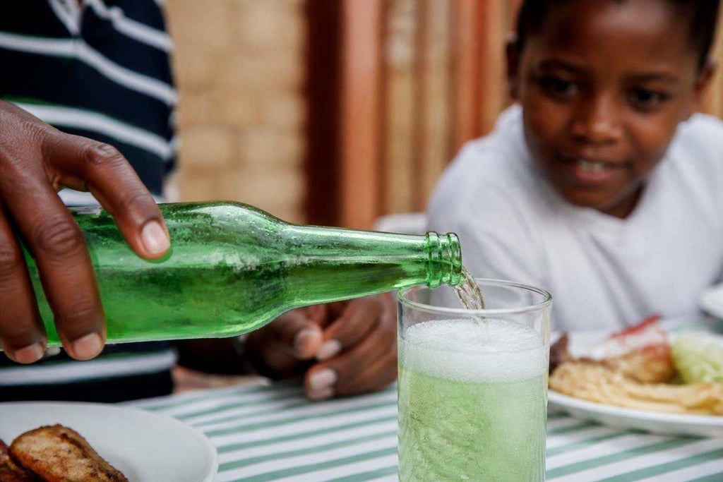 Bright green South African cream soda bottles showcasing the country's iconic sweet vanilla soft drink