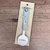 Enamel sugar spoon with wooden handle and laser engraved birds on a wire design