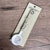 Enamel sugar spoon with wooden handle and laser engraved Fijnbos flower design