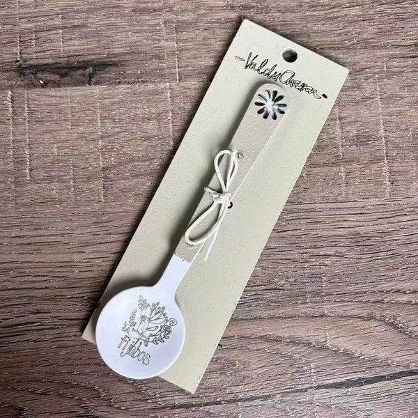 Enamel sugar spoon with wooden handle and laser engraved Fijnbos flower design