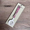 Enamel sugar spoon with wooden handle and laser engraved Fijnbos flower design
