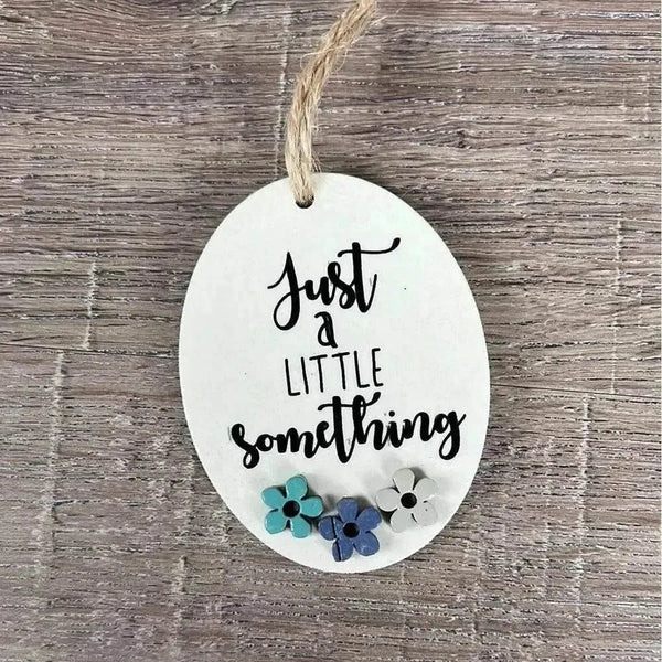 Wooden gift tag with "Just A Little Something" text