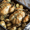 Ina Paarman Lemon & Herb Coat & Cook Sauce with roasted chicken and vegetables.