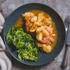 Plate of food featuring chicken and vegetables coated in Ina Paarman Peri-Peri sauce.