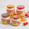 Melrose Cheese Spread jars displayed with cheese slices and tomatoes.