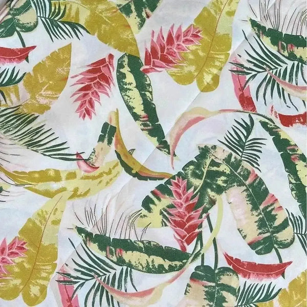 Beige tablecloth with pink and mustard tropical flower design for elegant dining setting