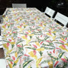 Beige tablecloth with pink and mustard tropical flowers for elegant dining