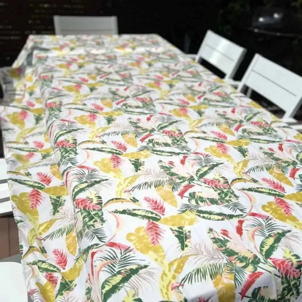 Beige tablecloth with pink and mustard tropical flowers for elegant dining