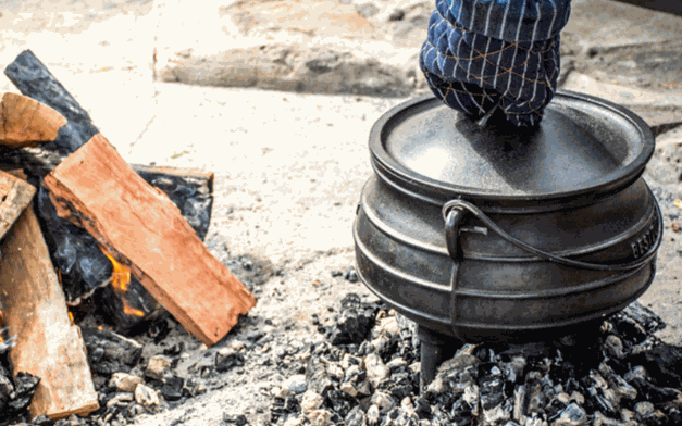 New potjie pot with protective wax layer on cast iron cookware surface