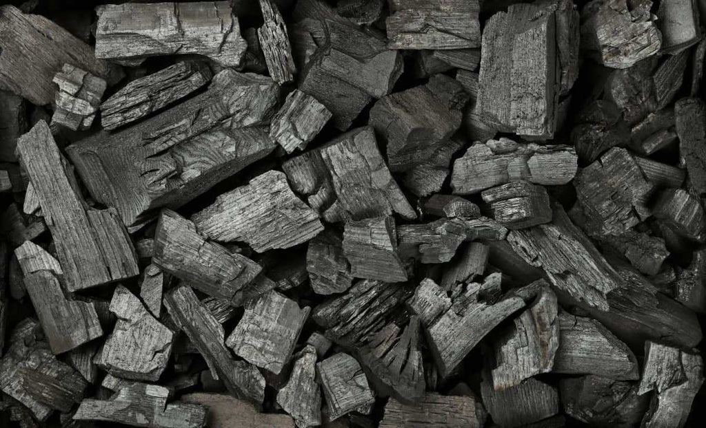 Close-up of natural lump charcoal pieces used for grilling and smoking