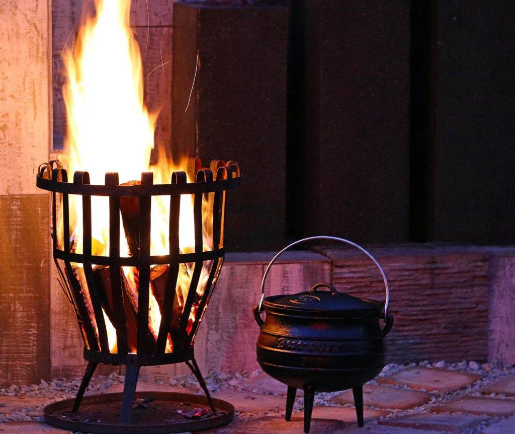 Cast iron potjie pot being seasoned and cared for with oil and heat