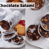 Sliced Bakers Chocolate Salami dessert with chocolate, biscuits, and icing sugar on a plate