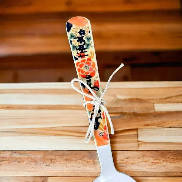 Enamel printed sugar spoon with wooden painted handle and Be You Tiful design