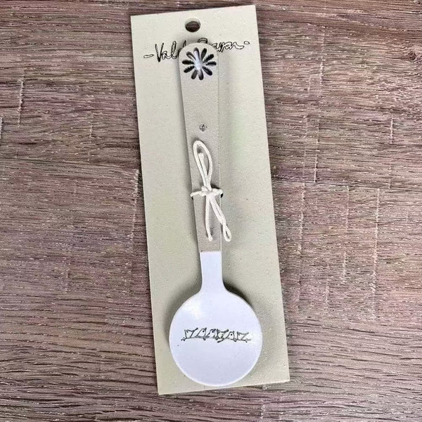Enamel sugar spoon with wooden handle and laser engraved birds on a wire design