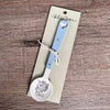 Enamel sugar spoon with wooden handle and laser engraved Fijnbos design